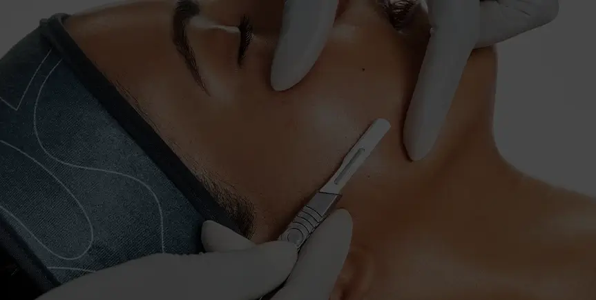 A smiling woman enjoying an expert massage service at Hand & Stone Massage and Facial Spa.